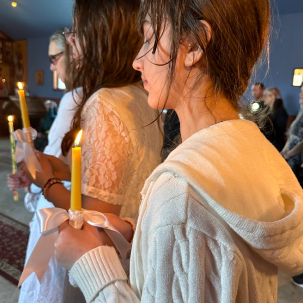 Two women during Baptism Ceremony in Progress